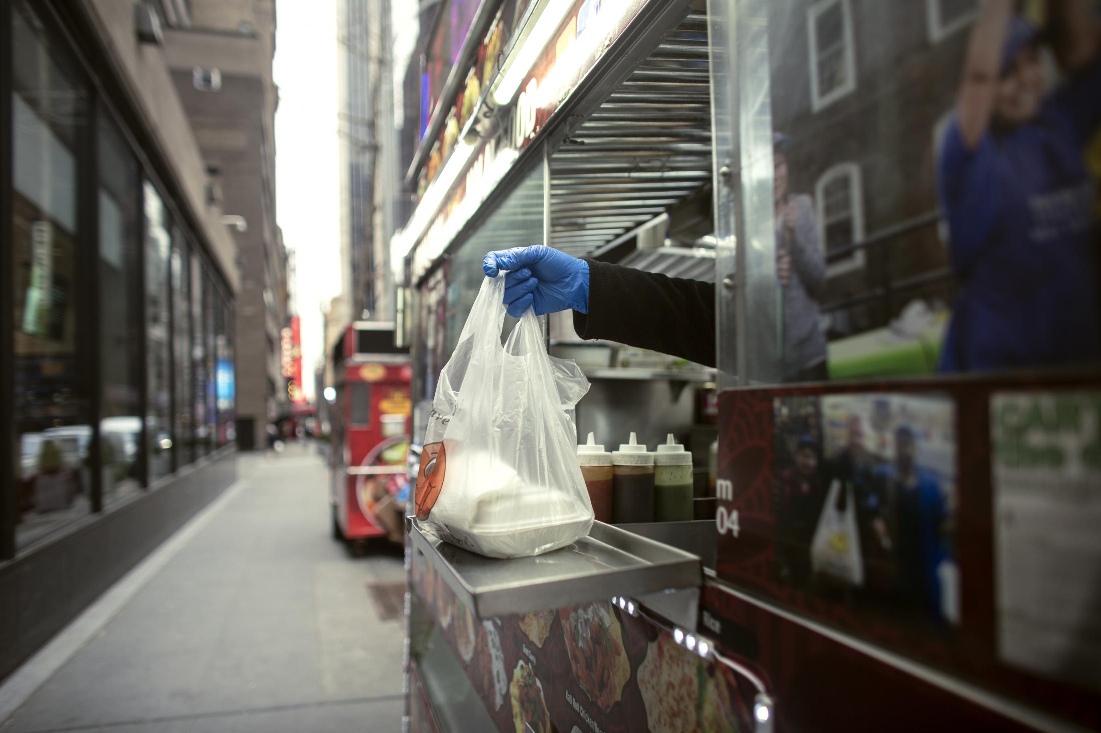 MD Alam working in his Halal food cart in Manhattan on Tuesday, January 26, 2020. He is among the street vendors in the city hoping to legally obtain licenses to sell food on the street.