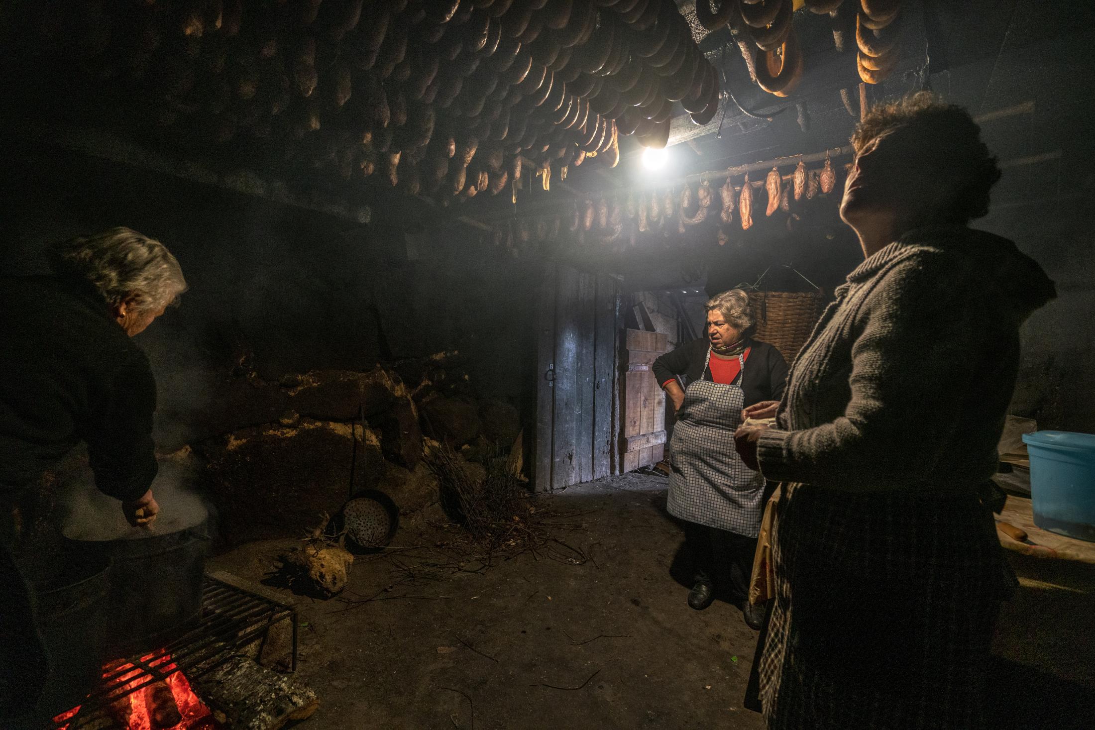 Barroso: An Ancient Farming Culture in Northern Portugal Becomes a World Heritage - Women cook at an ancient kitchen in Covas do Barroso...