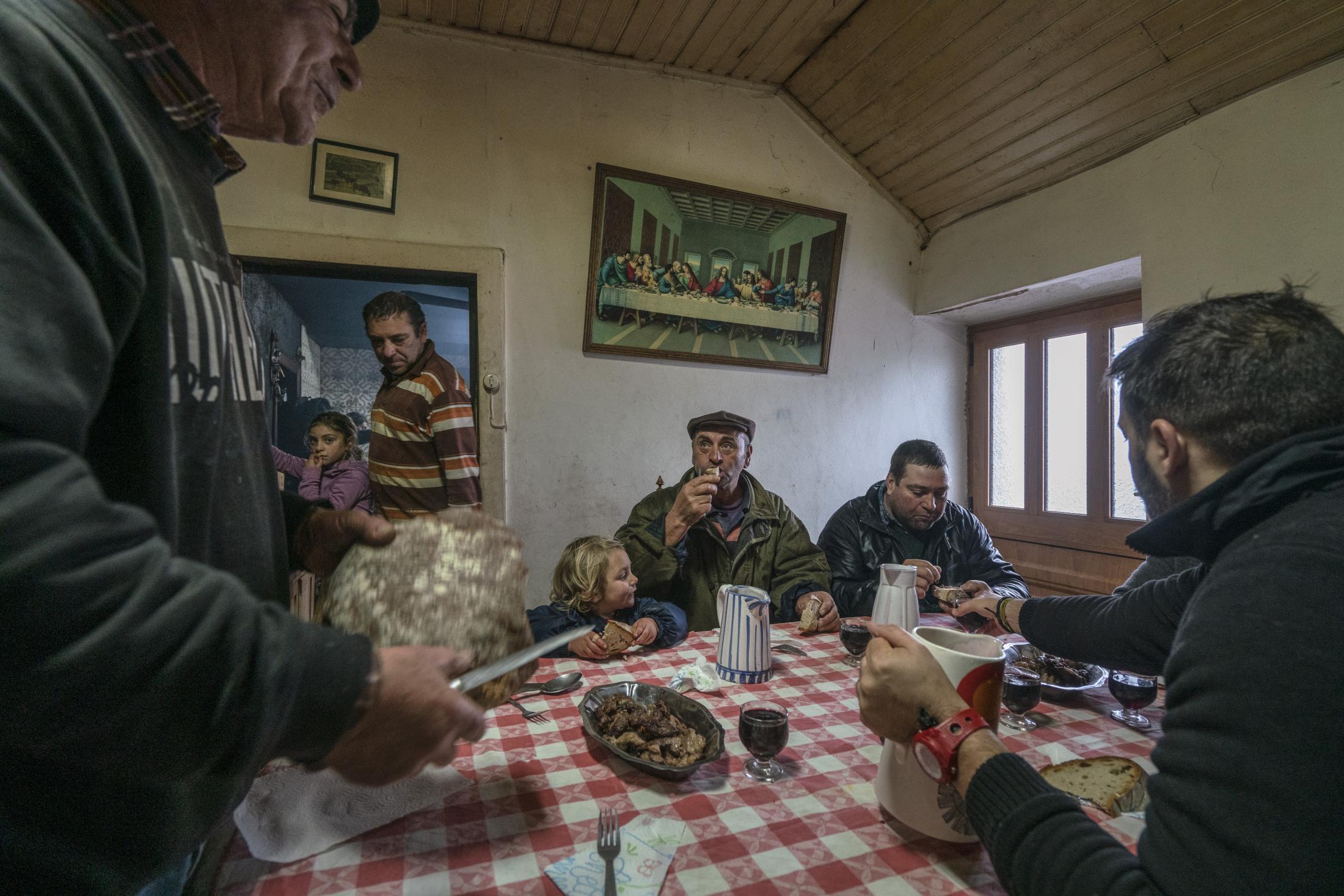 Barroso: An Ancient Farming Culture in Northern Portugal Becomes a World Heritage - Elias Coelho (left) serves homemade bread to his family...
