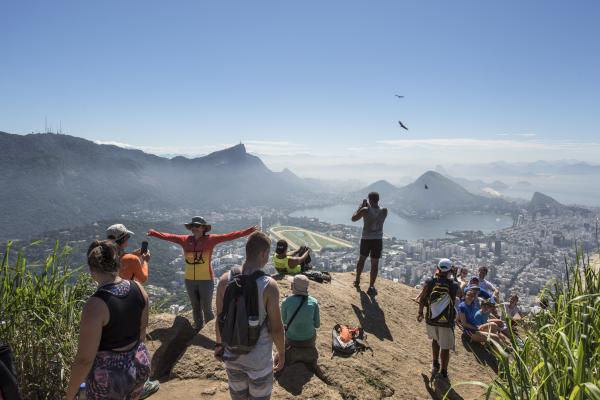 Vidigal - Tourists climb up the Dois Irmãos mountains using...