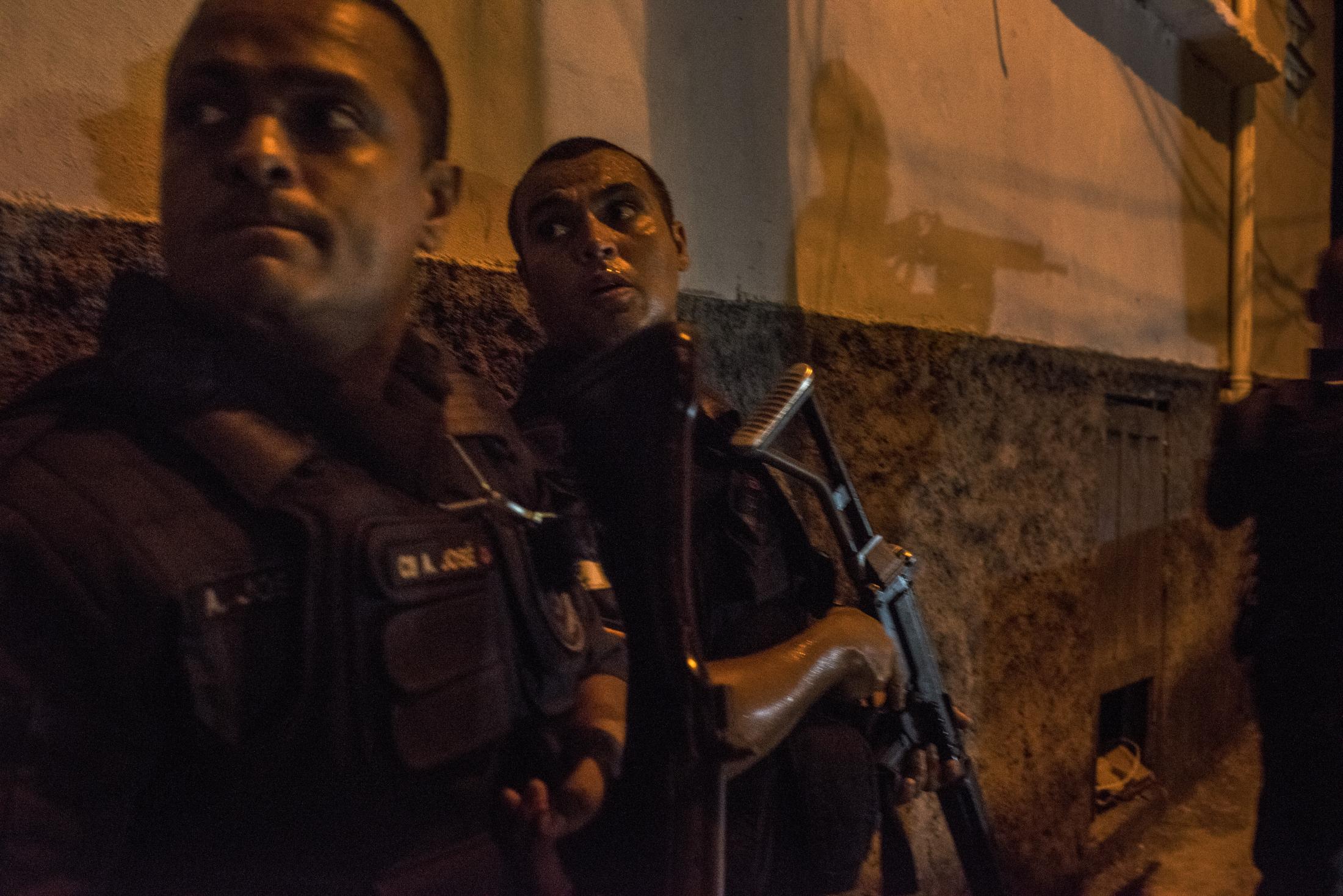 Vidigal - Police officers patrol the streets of Vidigal at night
