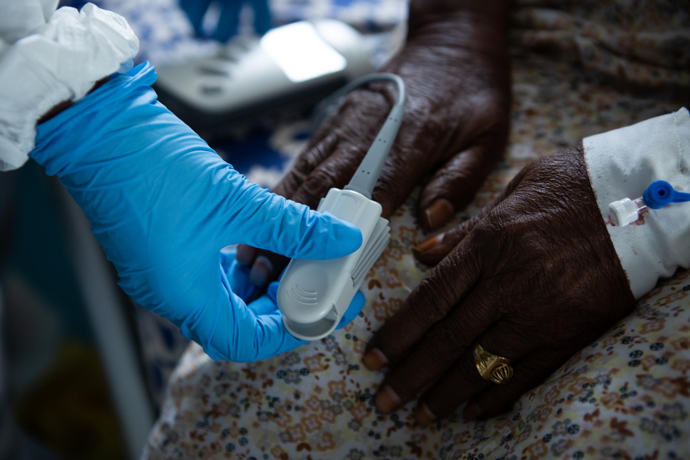 A day at a COVID -19 treatment centre in Somalia - A nurse checks the blood pressure of a patient at De...