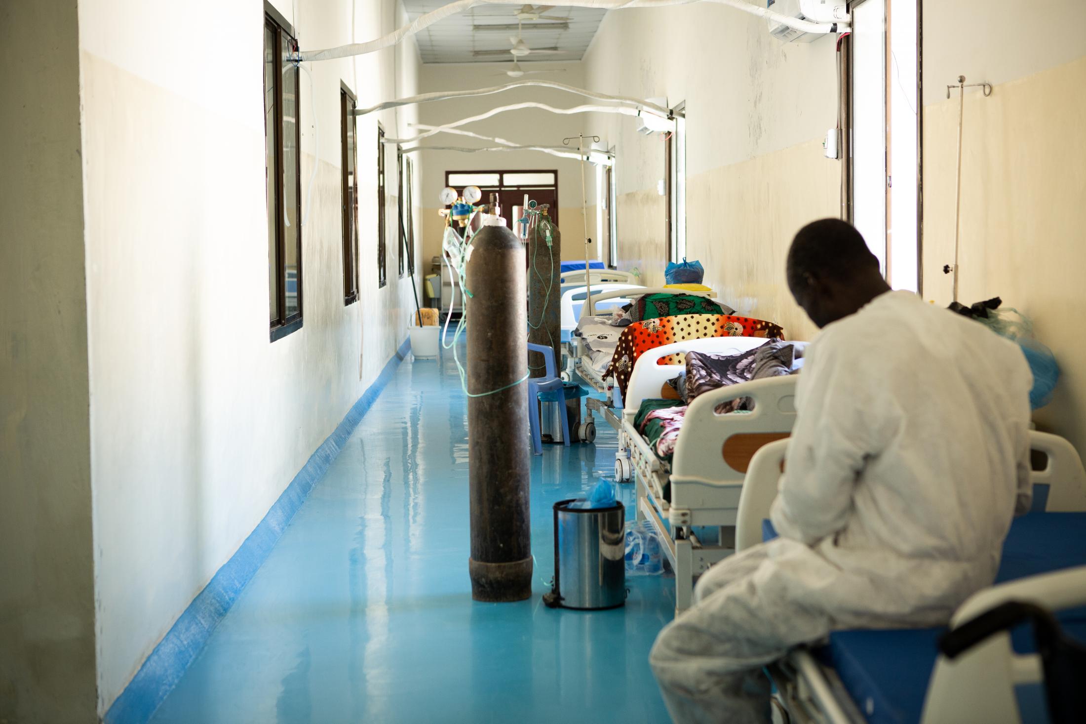 A day at a COVID -19 treatment centre in Somalia - A nurse rests in one of the beds on the corridors at De...