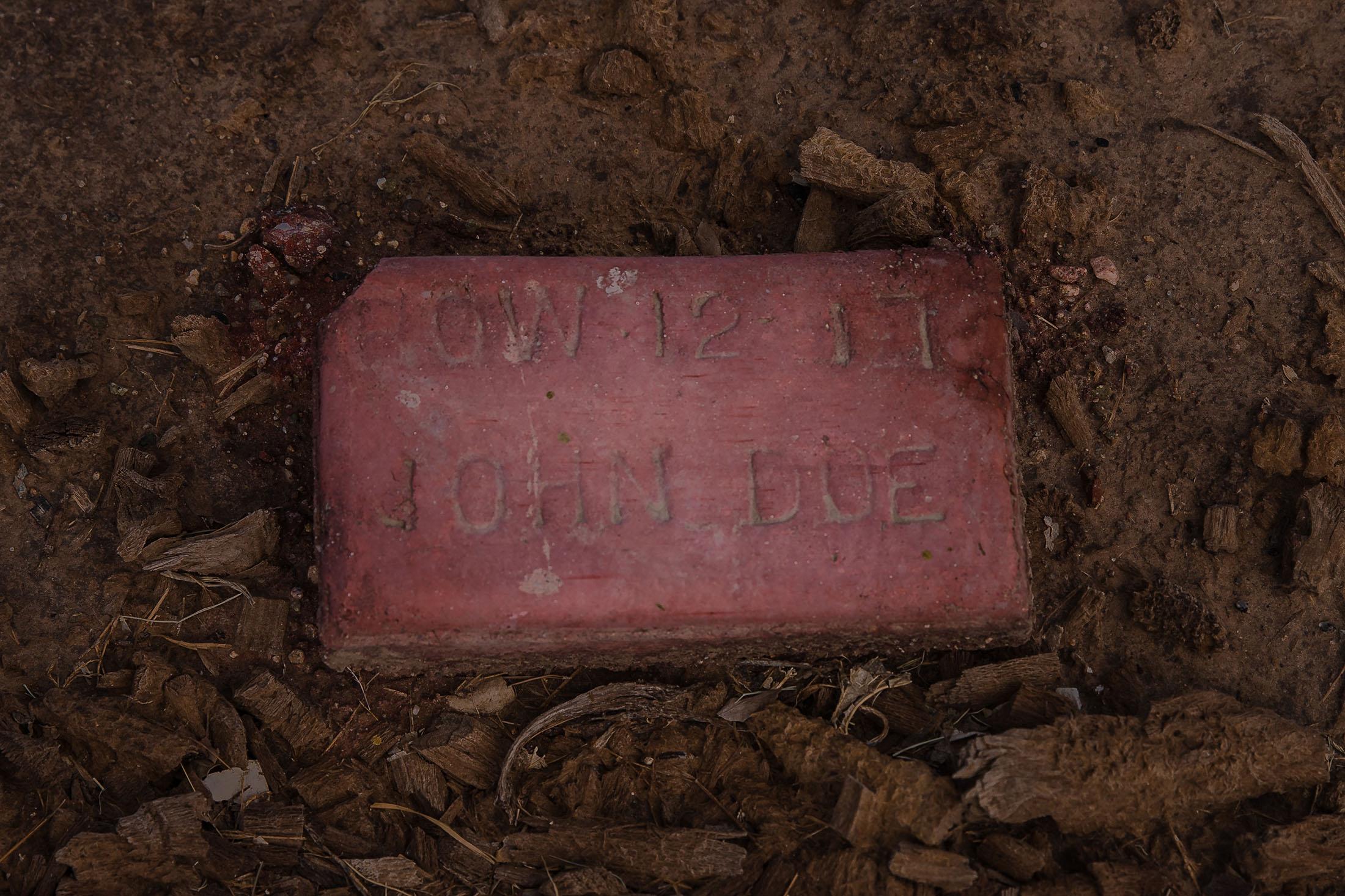 A &quot;John Doe&quot; buried at the end of Terrace Park Cemetery in Holtville, California on March 10, 2021. Undocumented immigrants, people who are not identified as well as family members who can&#39;t afford plots are buried in this section of the cemetery. As of last Wednesday 618 people have been buried, 357 are people whose names are known and 261 are John Does.