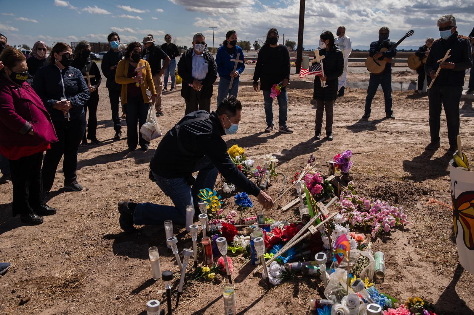 A vigil for the 13 undocumented immigrants who died in early March when an SUV and a tractor-trailer collided near Holtville, California is held at the crash site on March 10, 2021. Mourners lay crosses down with the victims names representing all 13 who lost their lives.