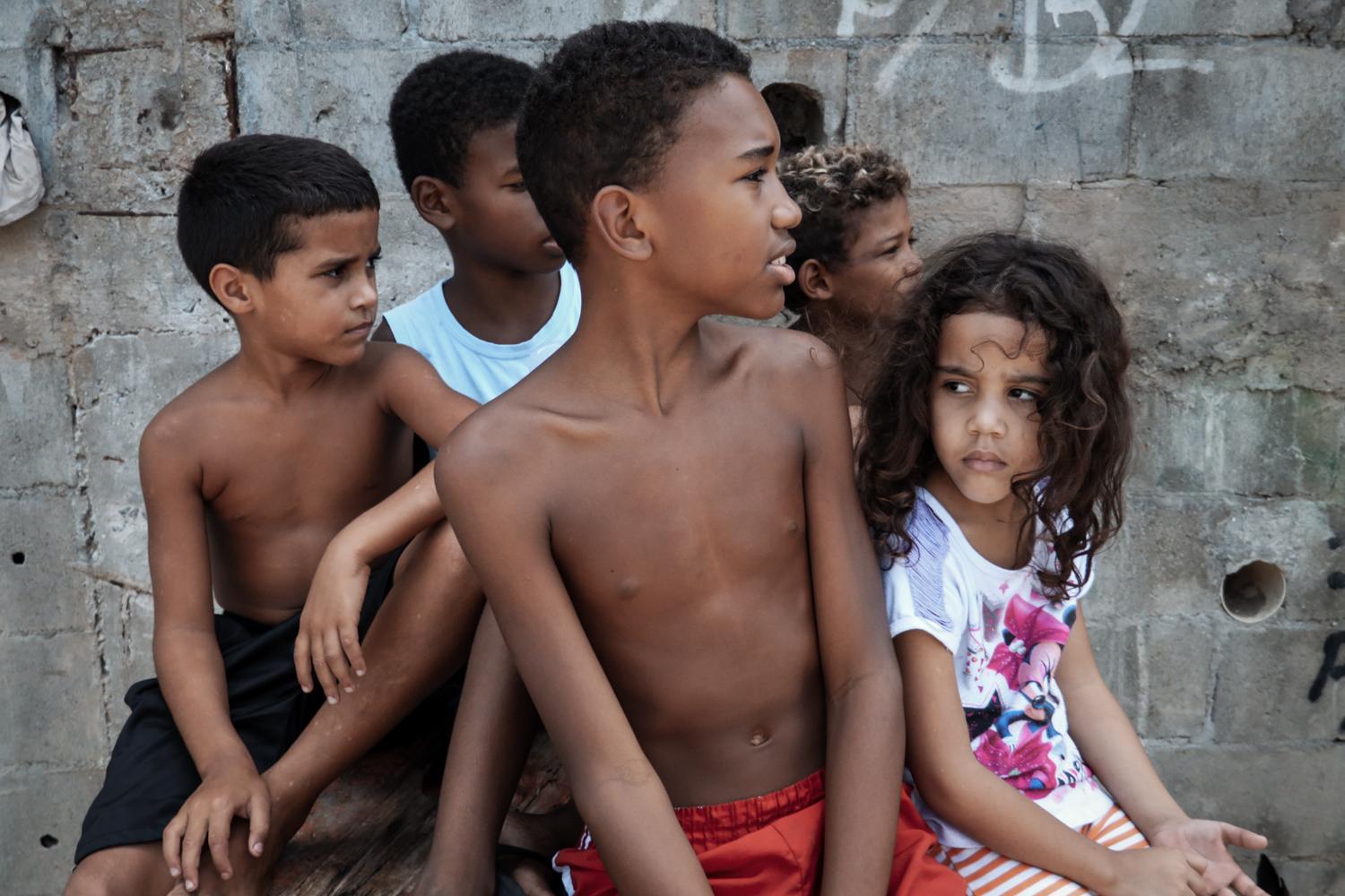 Beautiful and Broken - A group of young kids in the favela Pica-Pau in the far...