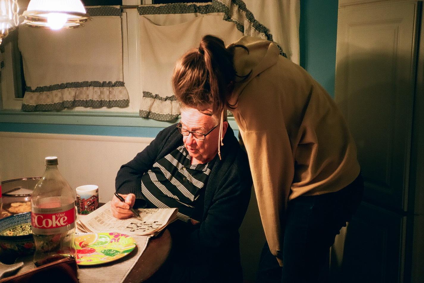 Becca and Grandpa doing a Crossword. Christmas, 2019
