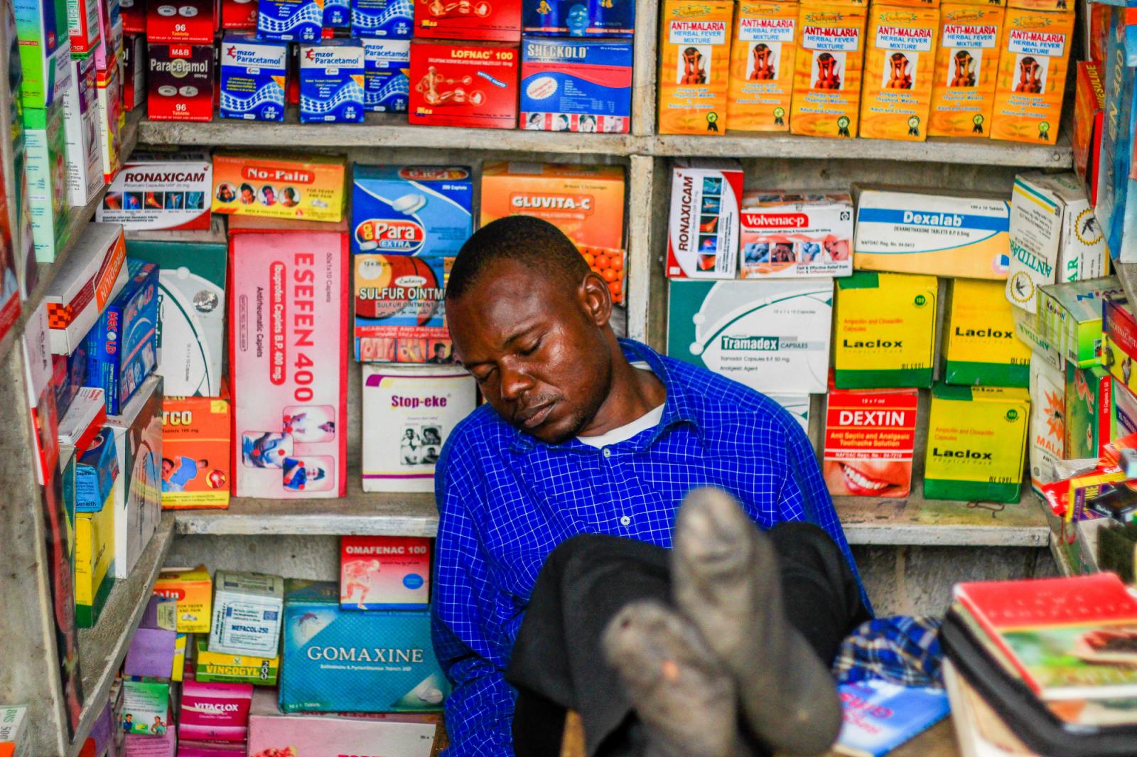 A drug store owner dozed off in his store drug in Lagos, Nigeria.