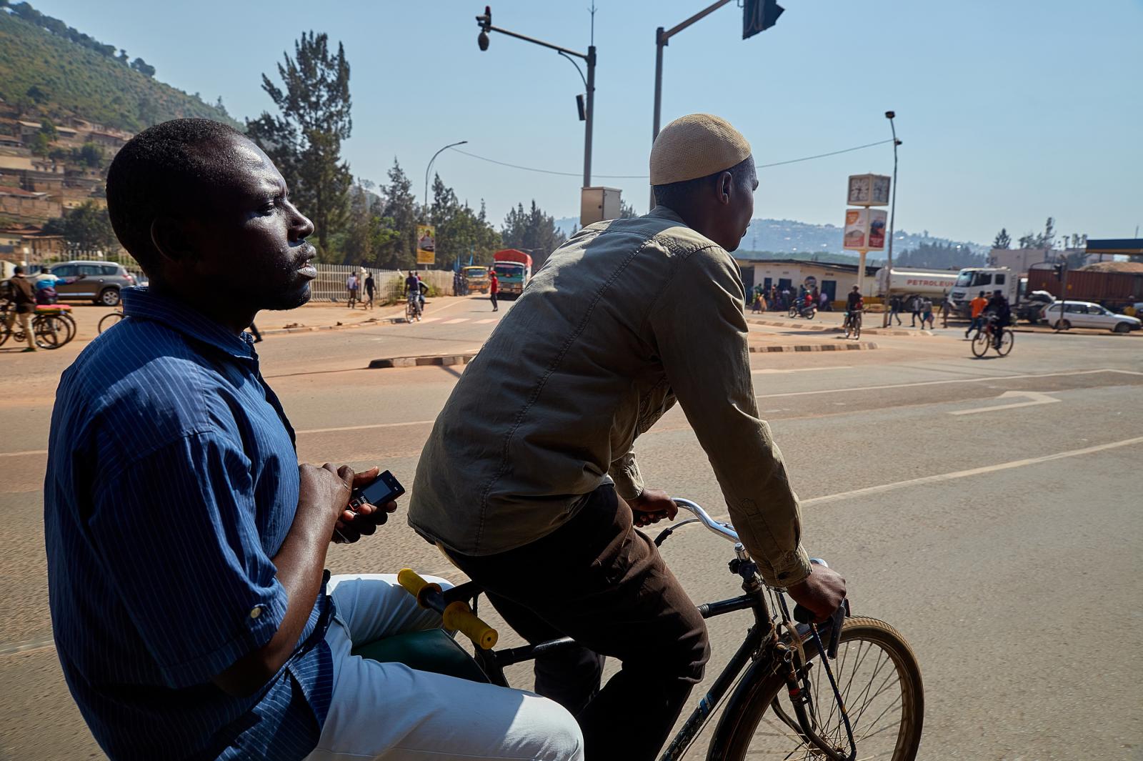 Pascal Itangishaka and a passen...uring a trip in Kigali, Rwanda.