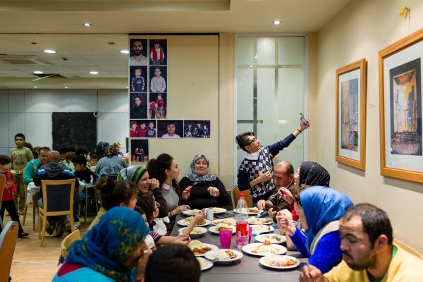Image from GREECE UNREST - A teenager takes a selfie with his family during the...