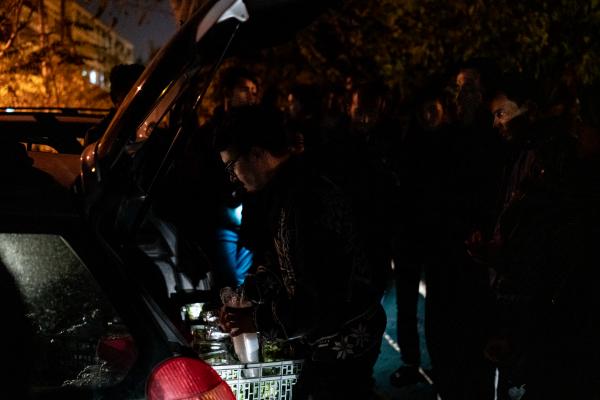 Image from GREECE UNREST - Homeless refugees gather around one of the cars of the...