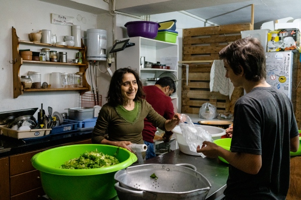 HIDDEN BEHIND THE RAILROAD - One of the activist at the Philoxenia kitchen - food and...