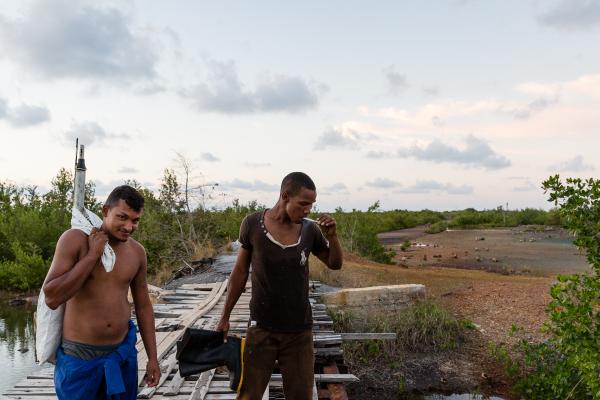 LA ISLA - CUBAN DIARIES - Juan and Livan, who is a fisherman, on the way back to...