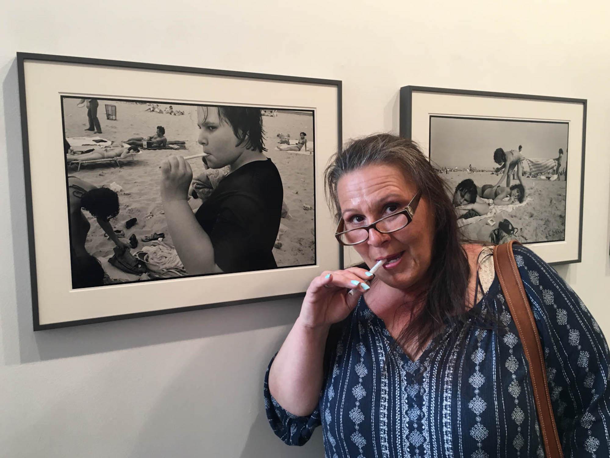 Prince Street Girls Exhibitions - Carol poses in front of her photograph at the Prince...