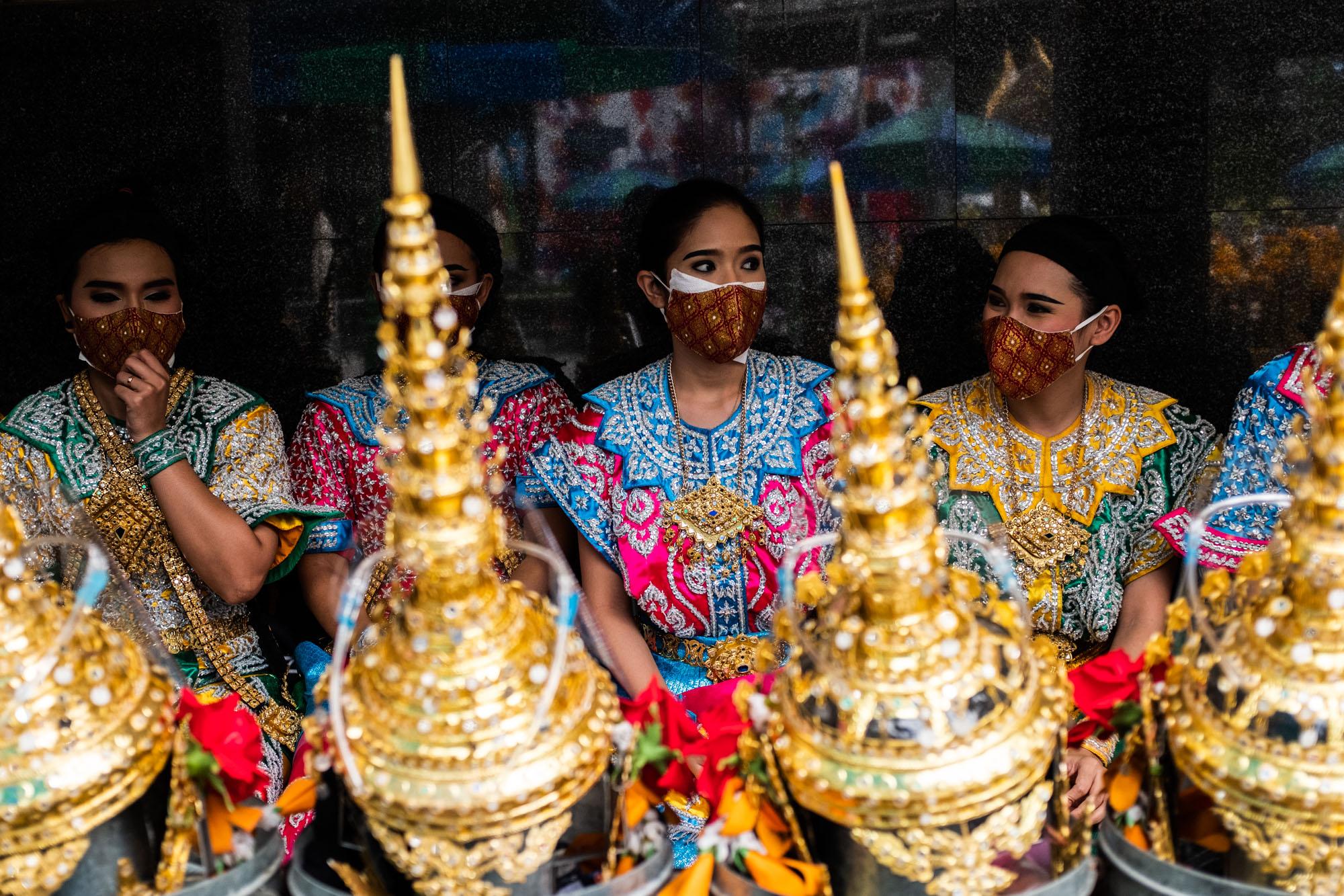 Covid-19: Thailand - Traditional Thai dancers wear face masks at Erawan Shrine...