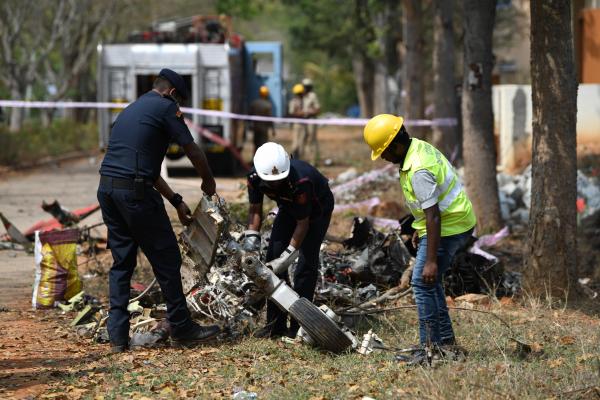 Ahead of Aero India 2019, a biennial event the Indian Airforce lost two of their pilots when the two Surya Kiran aircrafts crashed into each other during their practice session a day before the opening. Officials and clearing the debris from the crash.