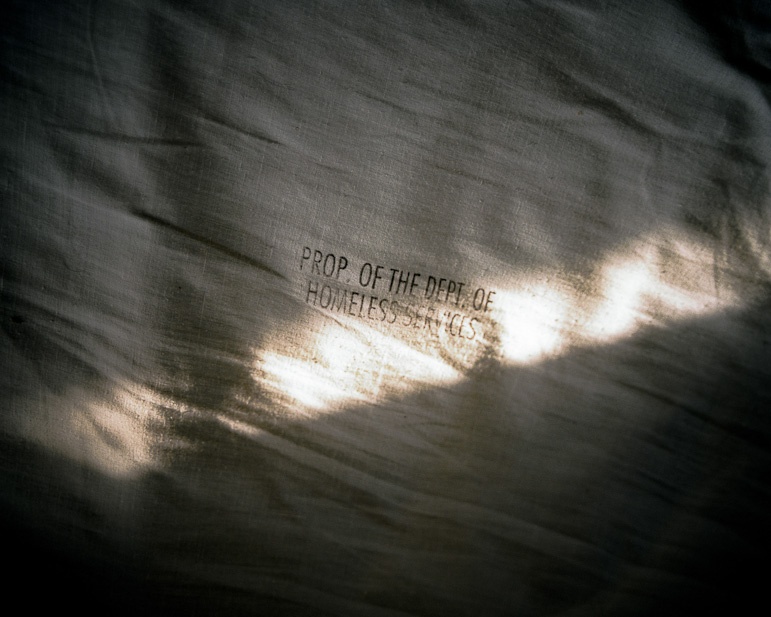 "Property of" stamp on a pillow case.