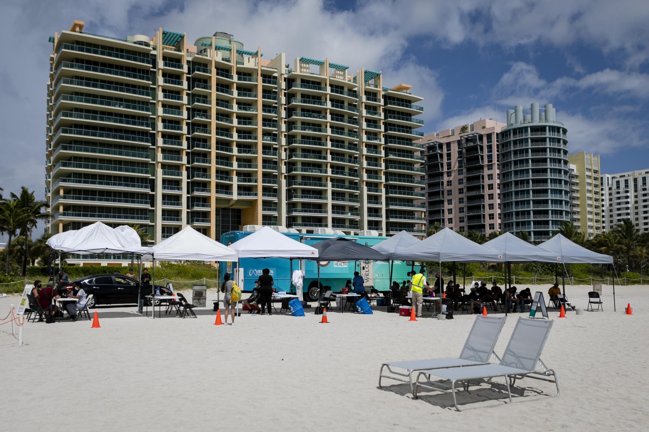 Tourists get Johnson & Johnson COVID-19 vaccine at Miami Beach - A pop-up vaccination center is seen at the beach, in...