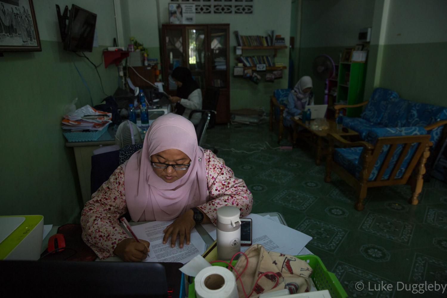 Anchana Hemmina works on a repo... office of Duay Jay in Pattani.