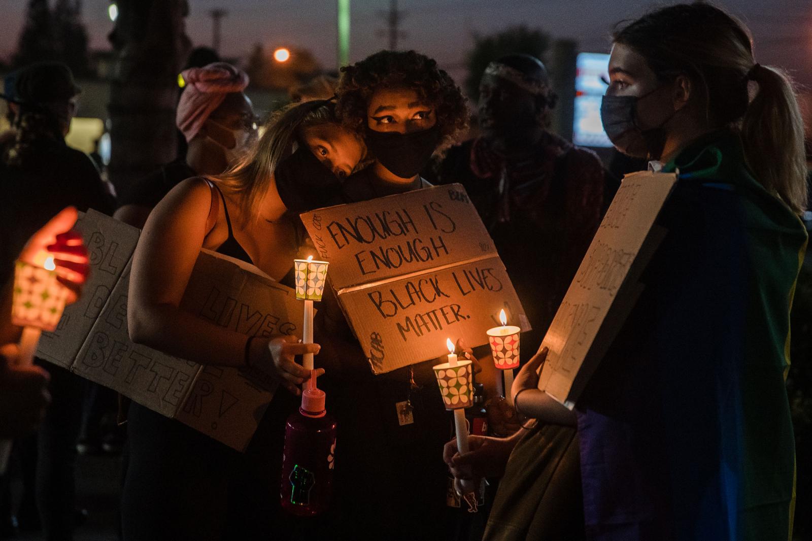 Protesters get ready to march for the fourth anniversary of Alfred Olango&#39;s death in San Diego, California on September 27, 2020.