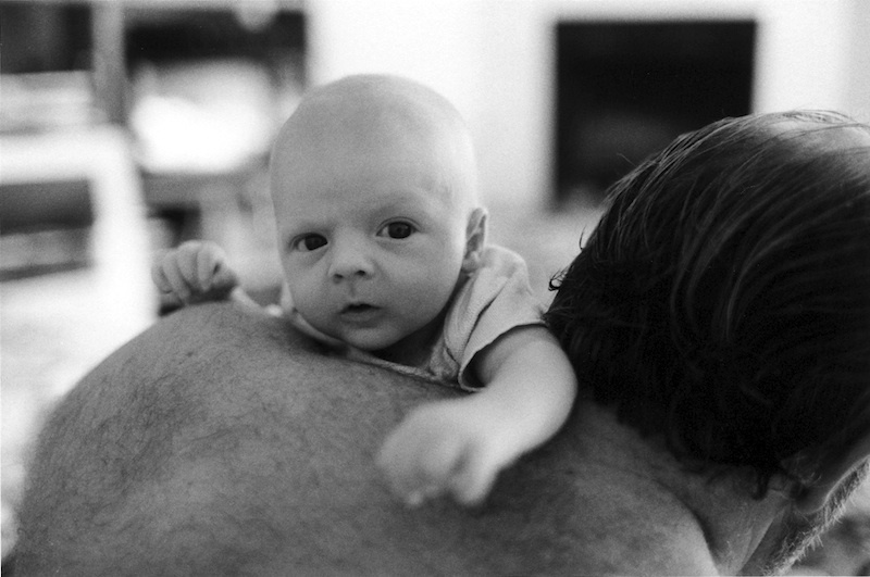  Newborn at home with Dad. 