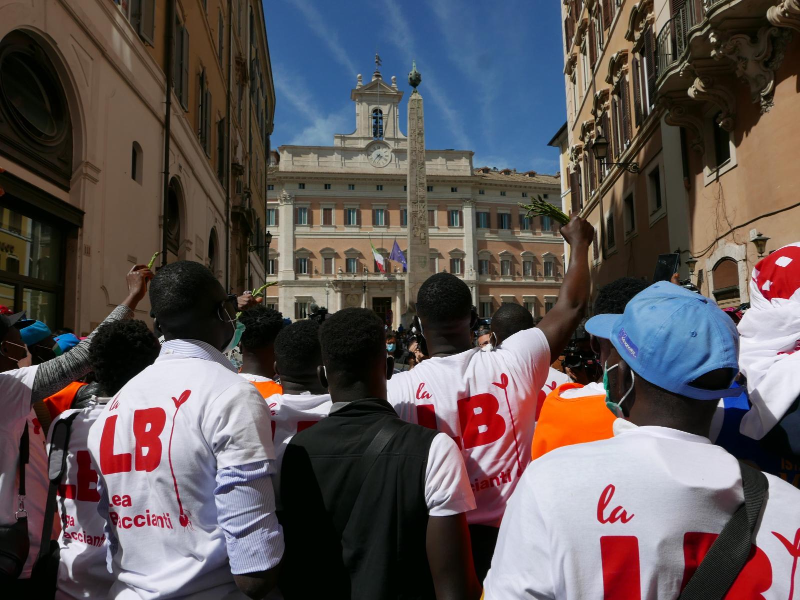 Protest of  African farmhands in front of Italian Parliament house
