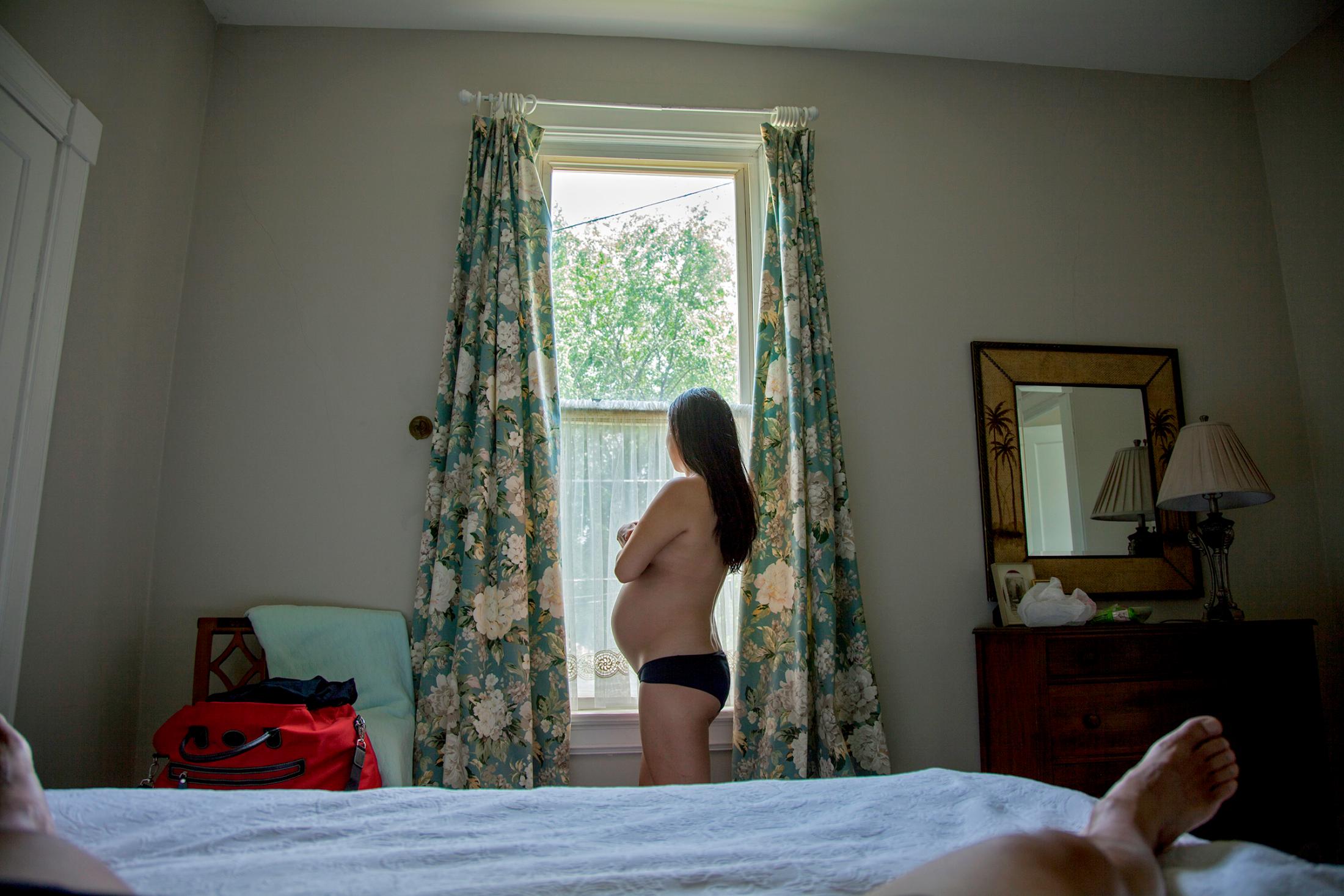 Motherhood and the Military - Self-portrait at a B&B in between duty stations,...