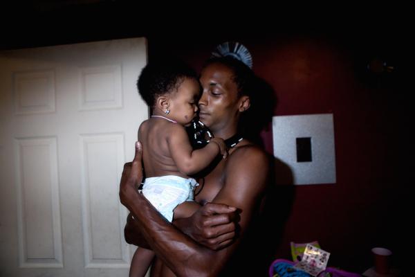 Image from Portraiture - Little Rayray is being embraced by her loving uncle...