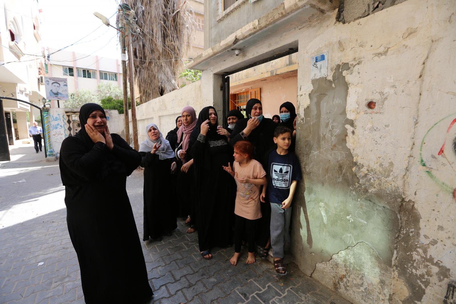 The women of the relatives of Hoda al-Khozindar, 33, a mother of four child who she were killed...