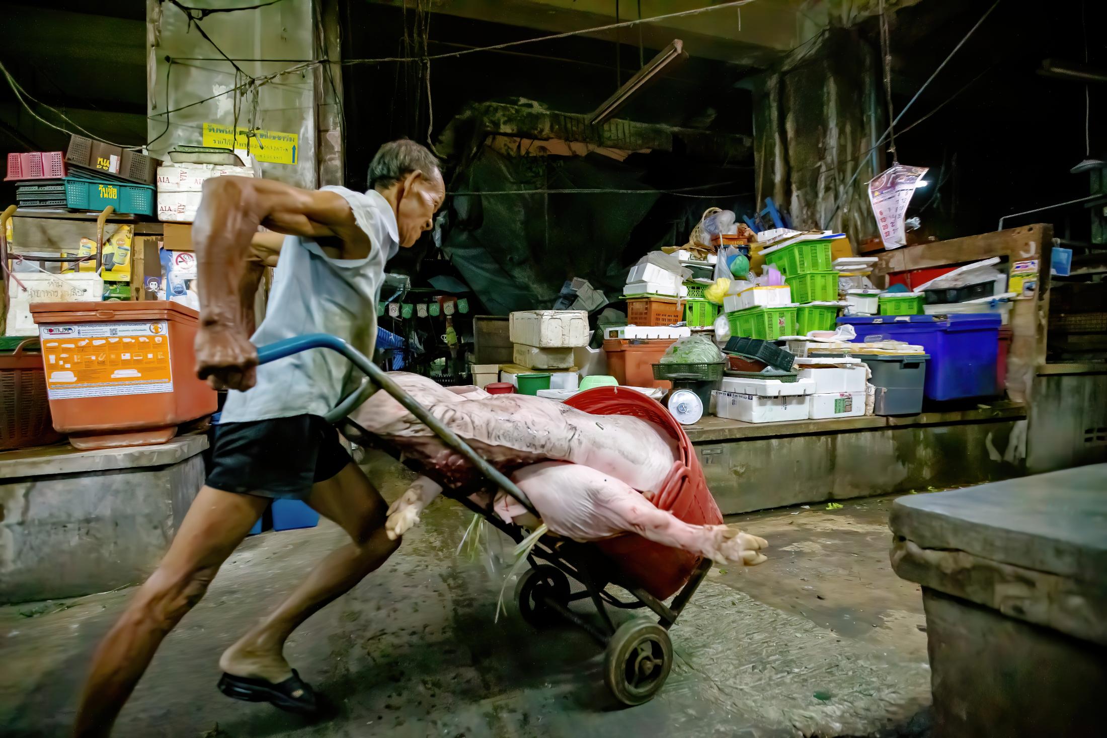 Uncle Chet`s Meat Supply - Moving the heavy cart along the congested walkways