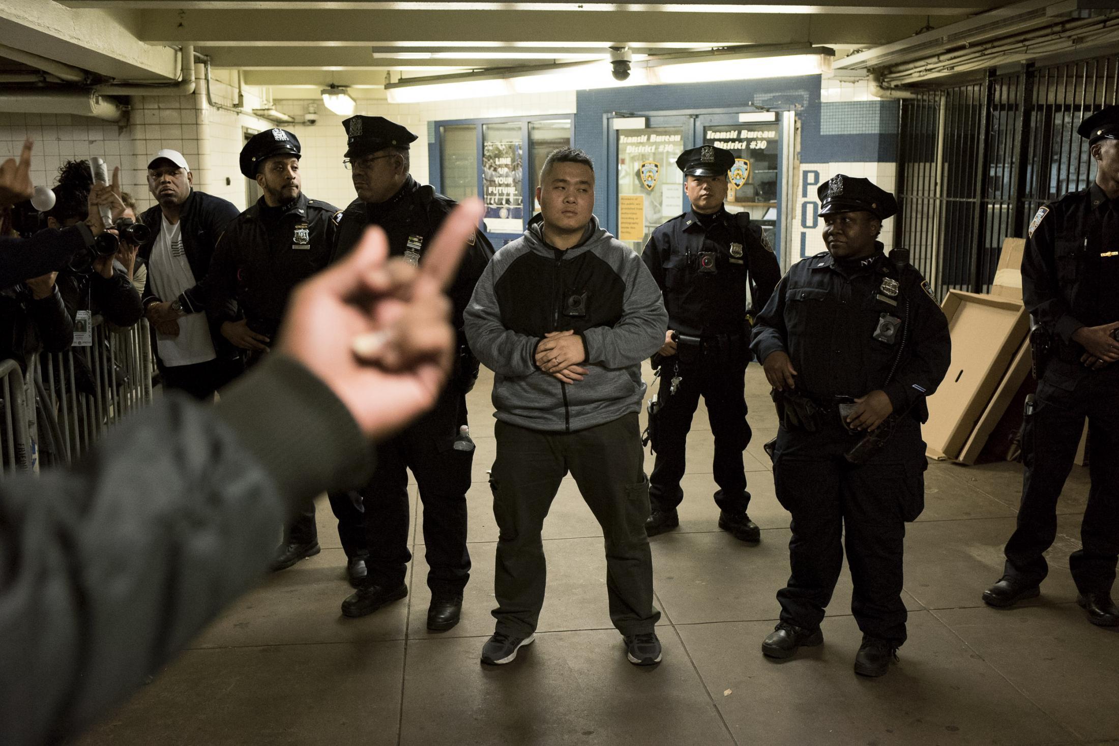 A group of protesters confronting NYPD officers inside a subway station, at a protest for the...