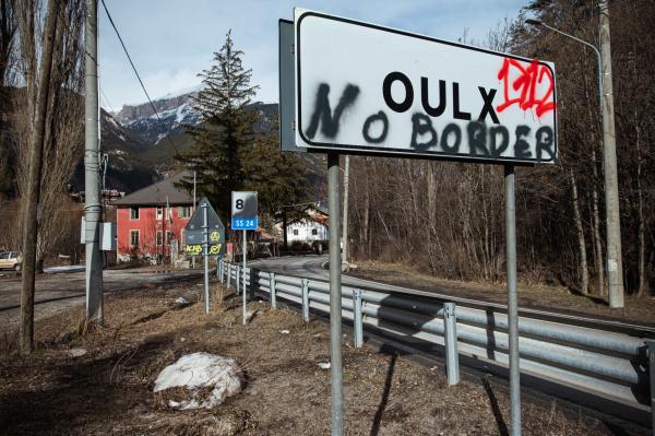 Image from THE ALPINE ROUTE - A no border sign, in front of the occupied house called...