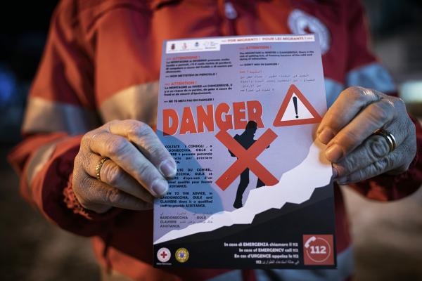Image from THE ALPINE ROUTE - The Red Cross volunteers warn migrants every night about...