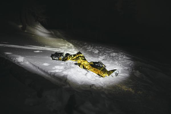 Image from THE ALPINE ROUTE - A thermal blanket left by a migrant on the path to France.