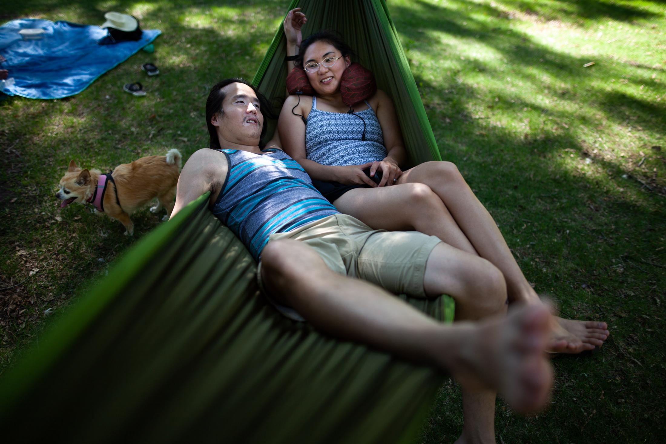 Singles - Bao Nguyen and Sheera Maano relax in a hammock in St....