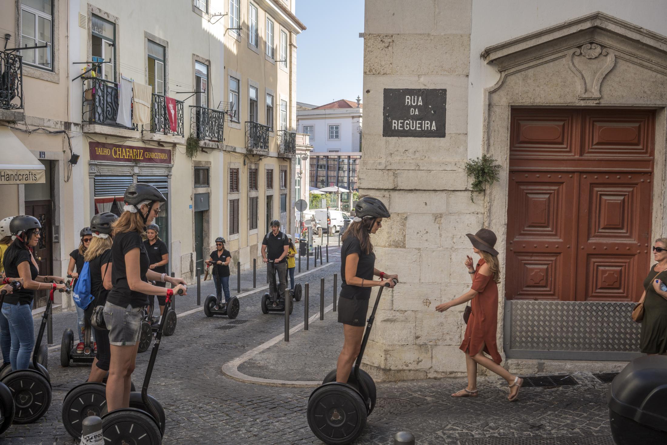 Lisbon - Tourists in Alfama, a historic working class neighborhood...