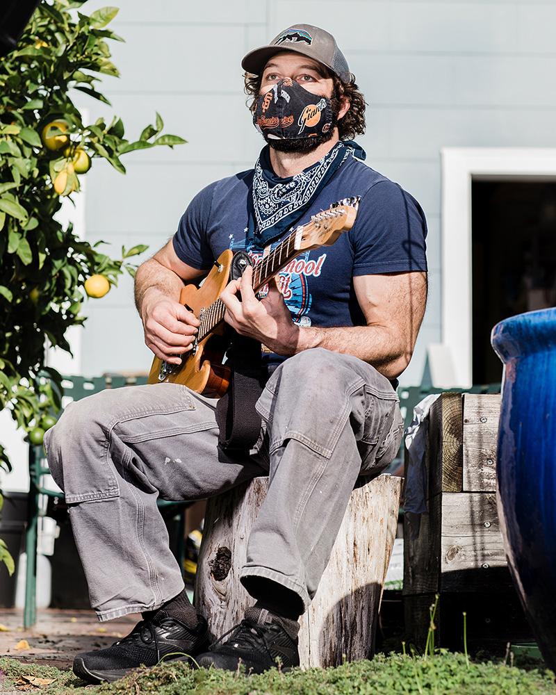 Housing War on The Water - Jacob Lavinghouse sits with a guitar he made at his parent&#39;s home in San Francisco Jacob,...