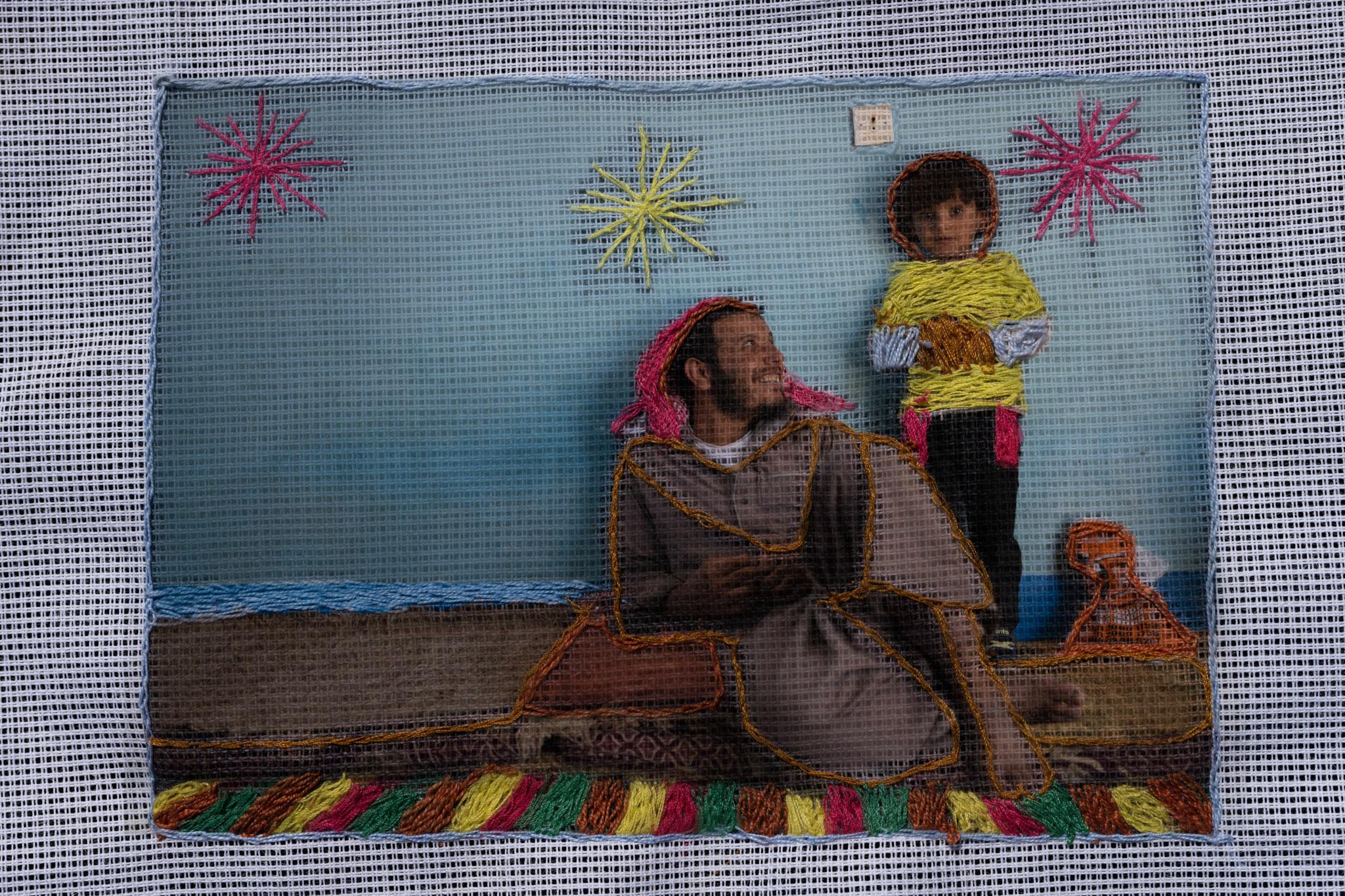 On National Geographic: In one of Egypt's most spiritual places, Bedouins find peace and resilience - An embroidered photograph by Nora Oum Jamil of her husband Ashraf and her youngest son Jamil in...