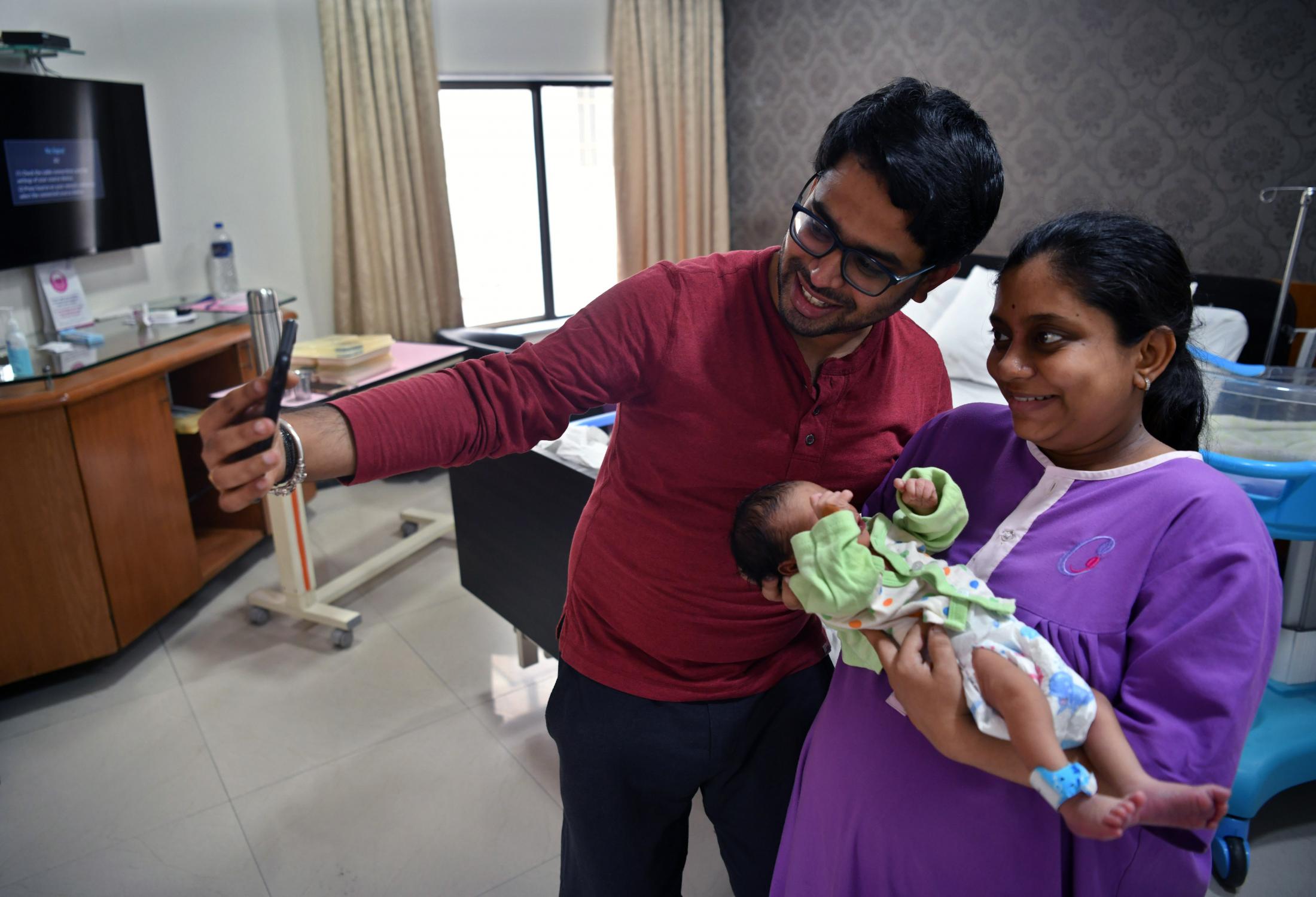 Chandana and her husband &nbsp;introduce their new-born daughter to her sister-in-law over a video call