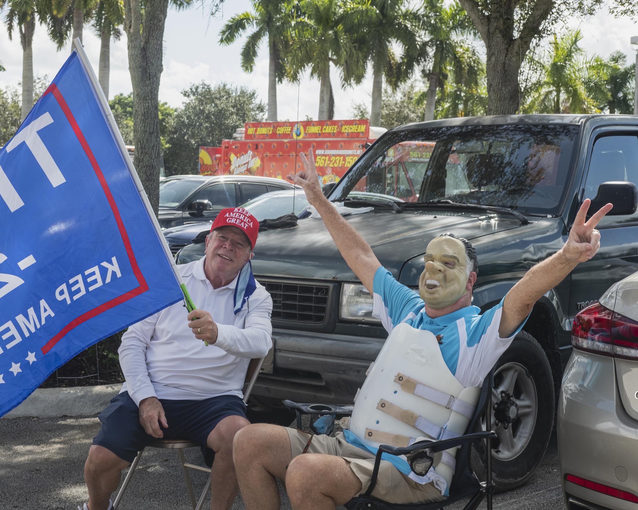 Weston, Fl. 2020 Election: Early Voters -  Larry and Tom (with Nixon mask) sitting in the parking...