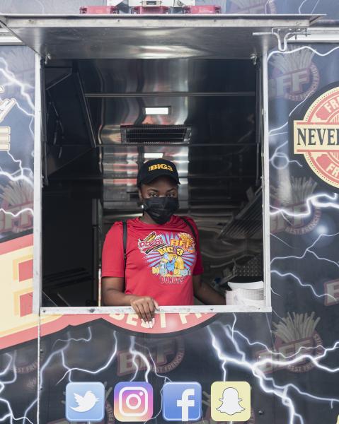Weston, Fl &ndash; October 29, 2020: Vantasia, first time voter and food truck employee standing inside the food truck at the Broward County Library Weston Branch - an early voting location. Credit: Andres Guerrero