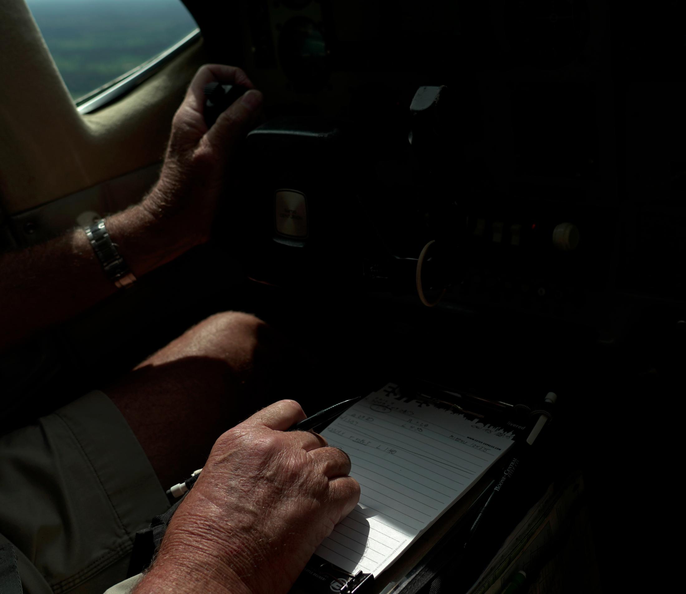 Help From Above - Pilot Steve Wendling marks down his speed and the...
