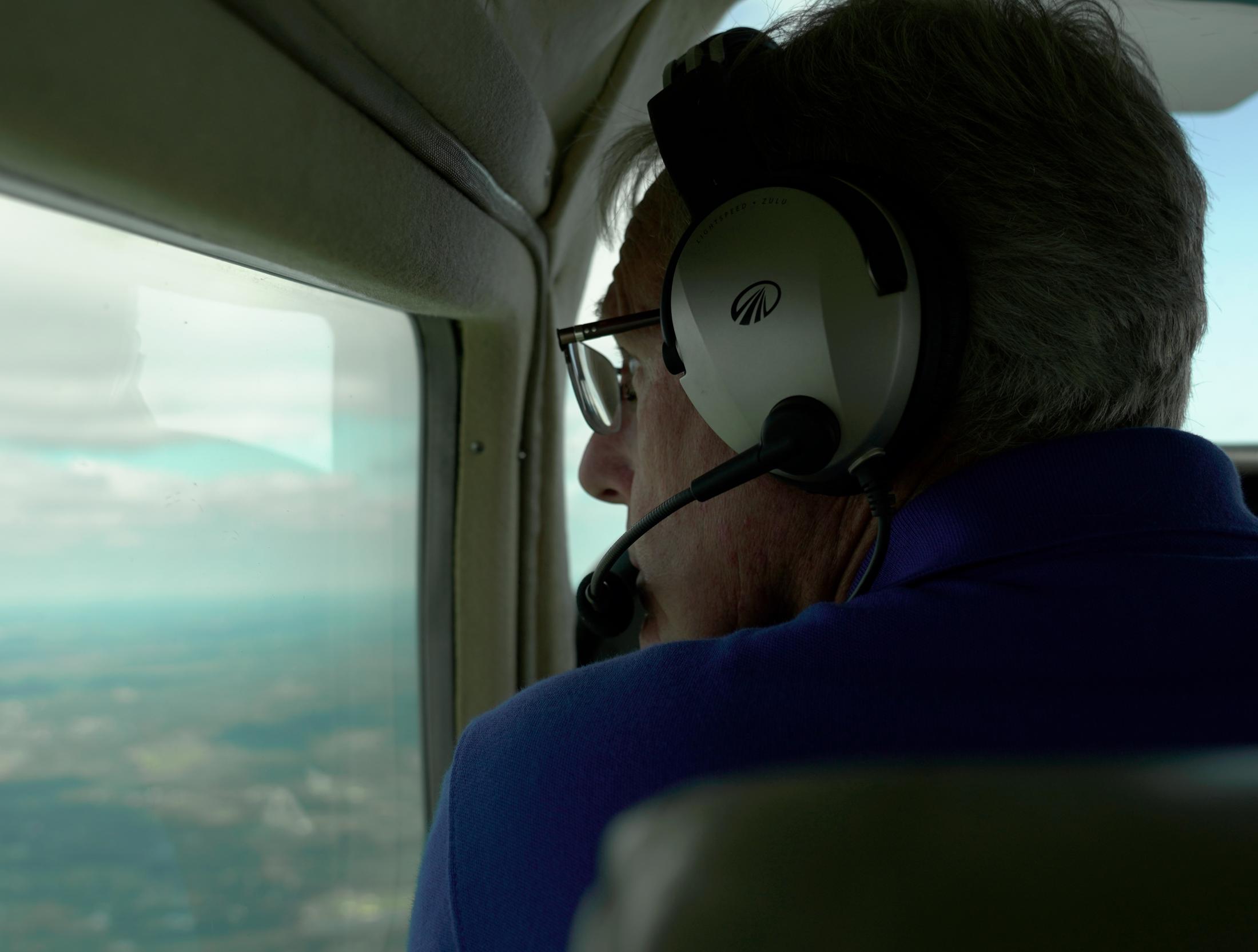 Help From Above - Volunteer pilot Steve Wendling gazes outside his window...