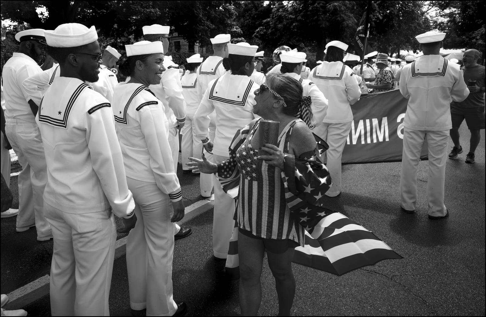 My Americana -  Woman, dressed in patriotic gear and sailors during the...
