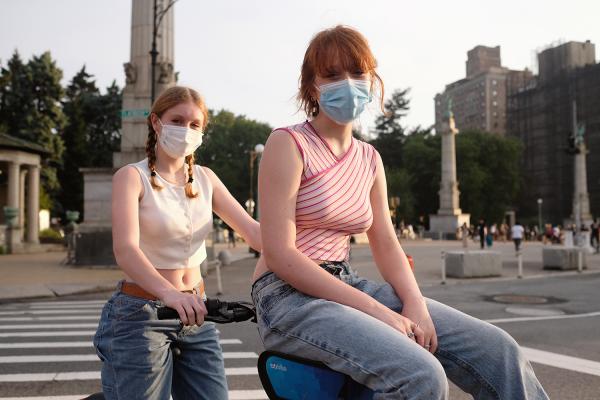 "New York is Back"? - Two girls on a citibike with masks on. June 2020, Brooklyn.