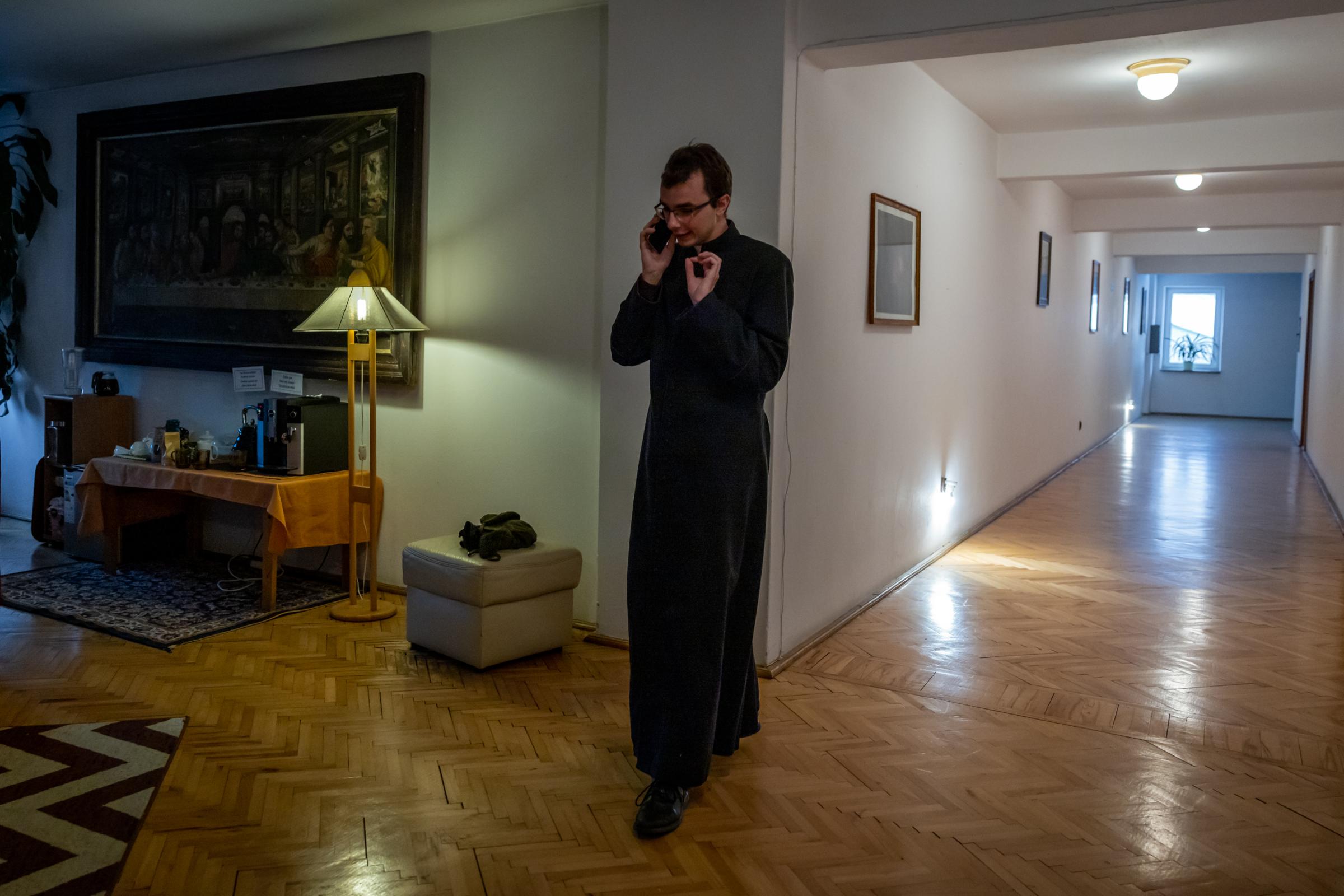 LONELY POLISH PRIEST -for NRC - Cleric Krzysztof Dzikowski talks to the rector priest...