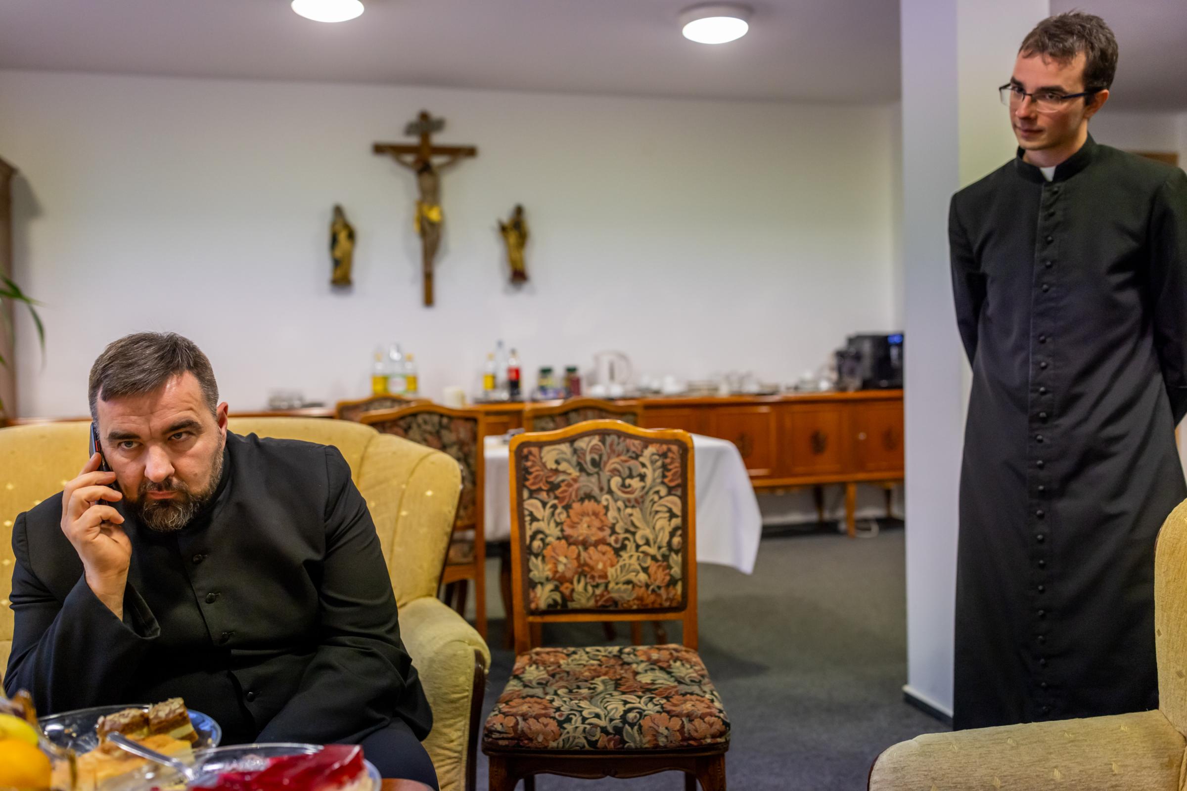 LONELY POLISH PRIEST -for NRC - Cleric Krzysztof Dzikowski, right, talks to the rector...