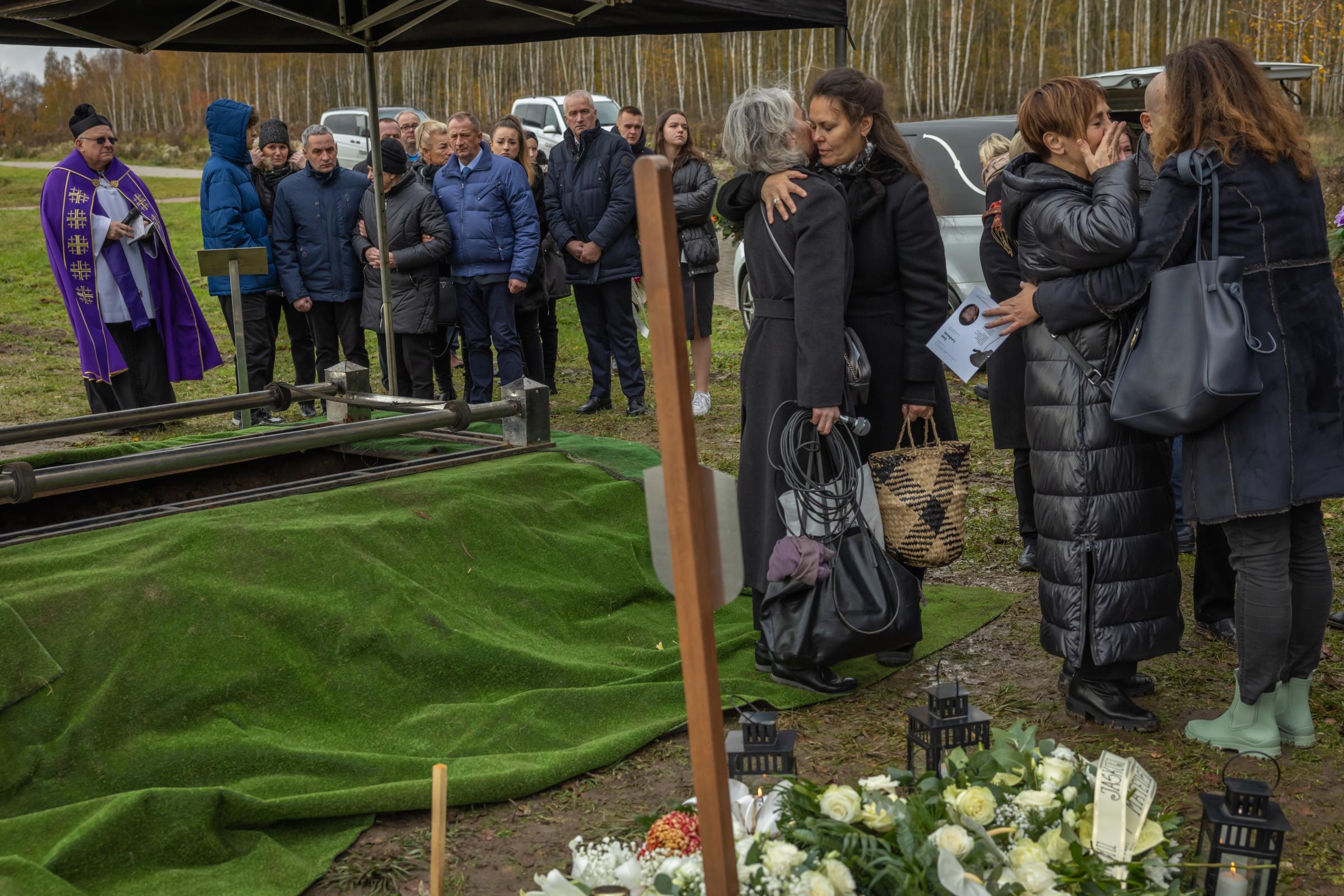 THE INSTITUTE FOR THE GOOD DEATH-for the Guardian - 04.11.2023 Elblag, Poland. Emilia Mandes (microphone in...