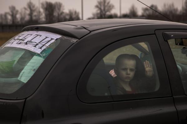 Image from OVER THE BORDER -  A sign that says “children” in Ukrainian on...