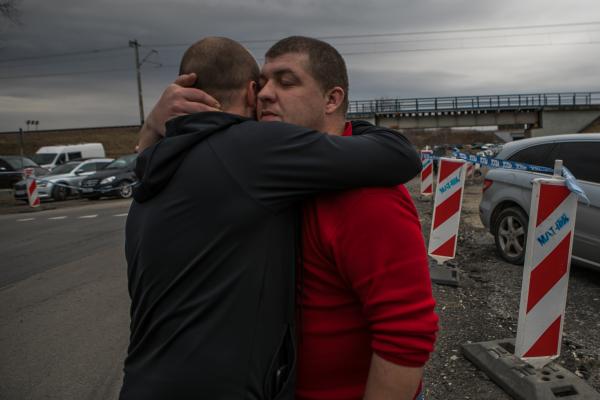 OVER THE BORDER -  From left to right; Ivan hugs his brother Voloymyr...
